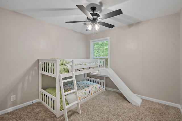 bedroom with light carpet and ceiling fan