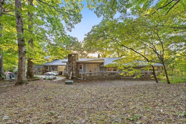 back of property with a patio area