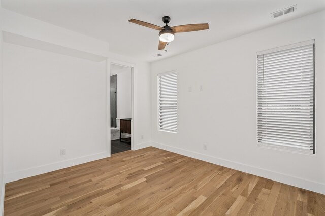 spare room with ceiling fan and light hardwood / wood-style flooring