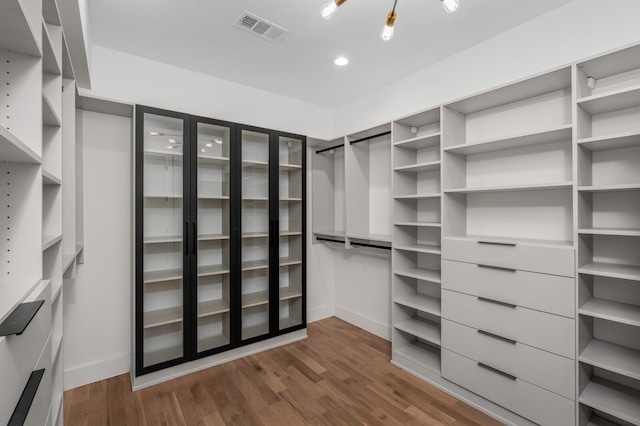 walk in closet featuring hardwood / wood-style floors