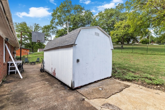 view of outdoor structure featuring a lawn