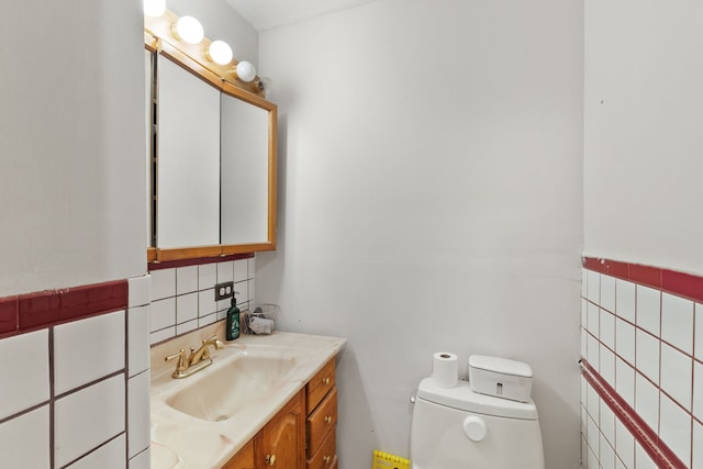 bathroom featuring decorative backsplash, vanity, and toilet