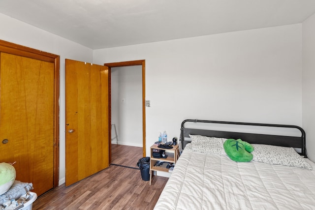 bedroom with hardwood / wood-style floors