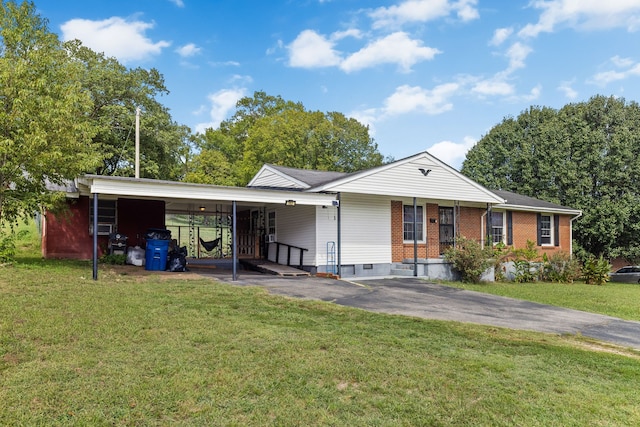 ranch-style home with a front yard and a carport