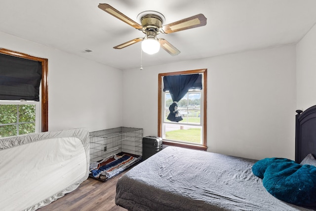 bedroom with ceiling fan and hardwood / wood-style floors