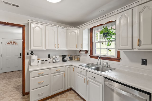 kitchen featuring sink, white cabinetry, and stainless steel dishwasher