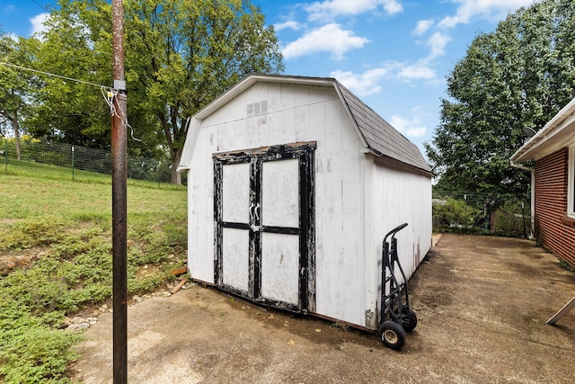 view of outdoor structure with a lawn