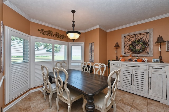 dining area featuring a wealth of natural light, a textured ceiling, and crown molding