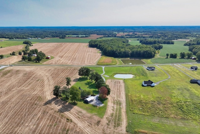 birds eye view of property with a rural view