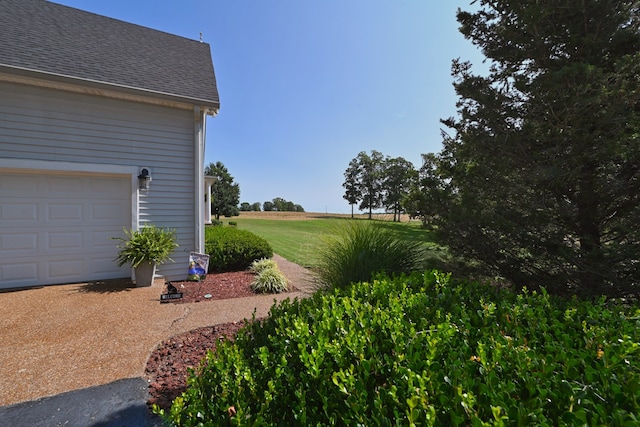 view of yard featuring a garage