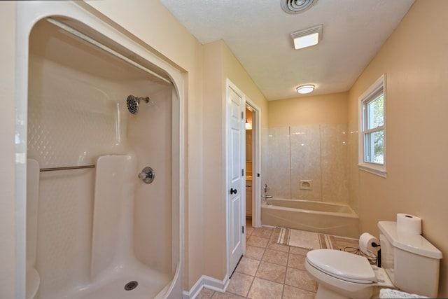 bathroom featuring plus walk in shower, tile patterned flooring, and toilet