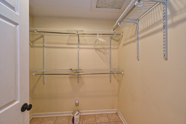 walk in closet featuring light tile patterned floors