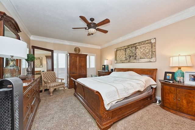 carpeted bedroom featuring ornamental molding, ceiling fan, and a textured ceiling