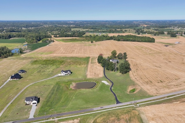 drone / aerial view featuring a water view and a rural view