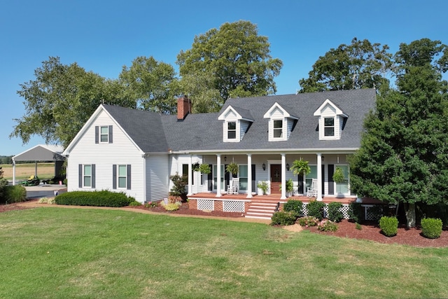 cape cod house with a front yard and a porch