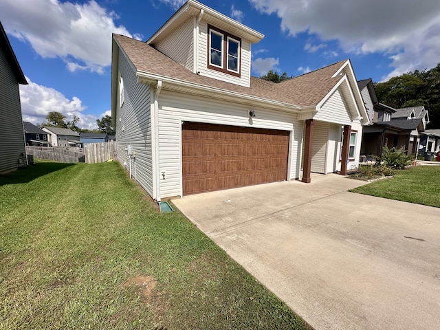 view of front facade featuring a garage and a front lawn