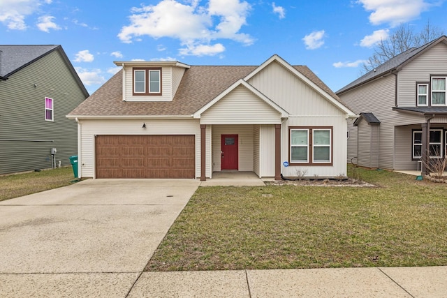 view of front of home featuring a garage and a front lawn