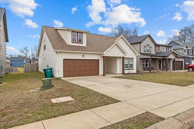 view of front of property featuring a garage and a front yard