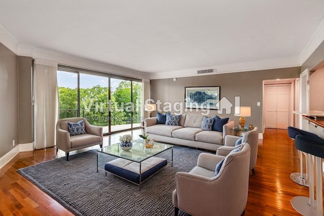 living room with crown molding and dark hardwood / wood-style flooring