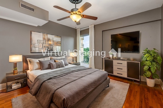 bedroom with ceiling fan, dark hardwood / wood-style floors, and access to outside