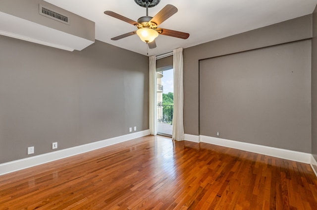 spare room featuring ceiling fan and hardwood / wood-style floors