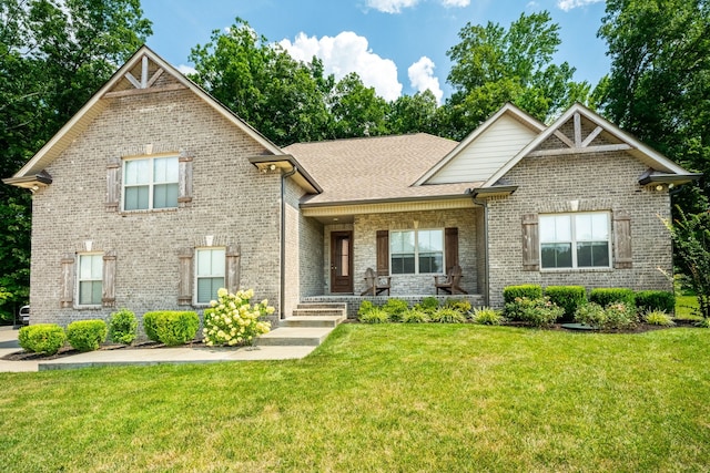 craftsman-style home featuring a front lawn