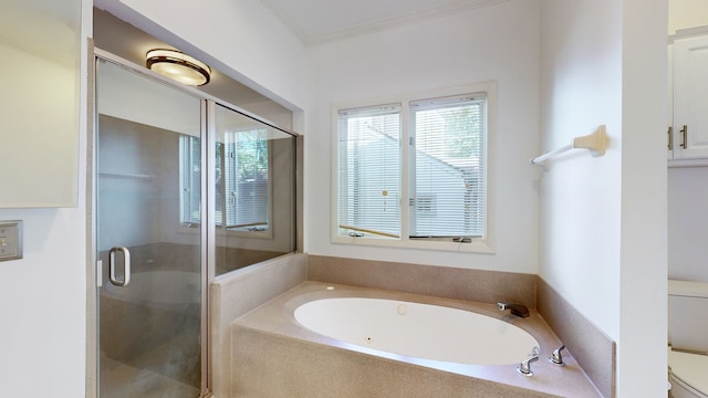 bathroom featuring independent shower and bath, ornamental molding, and toilet