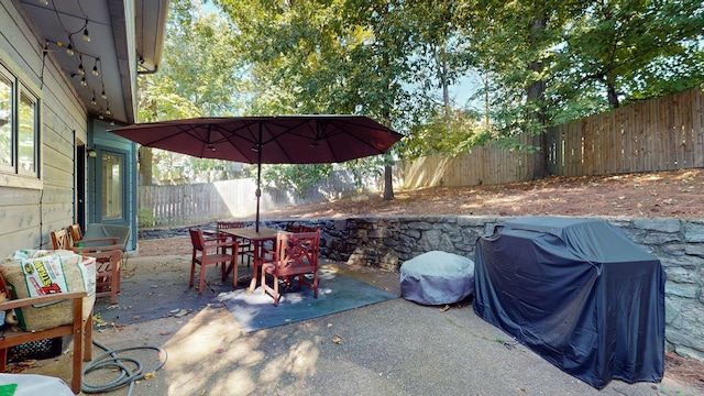 view of patio with a grill