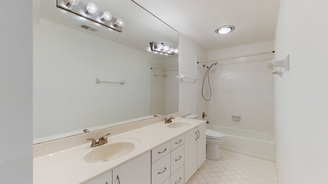 full bathroom with vanity, tiled shower / bath combo, toilet, and tile patterned flooring