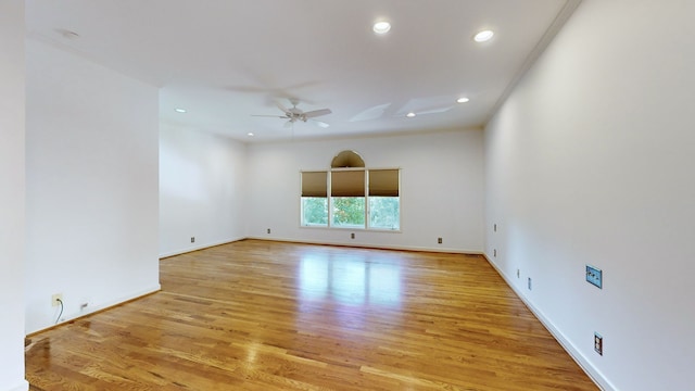 spare room with light hardwood / wood-style flooring and ceiling fan