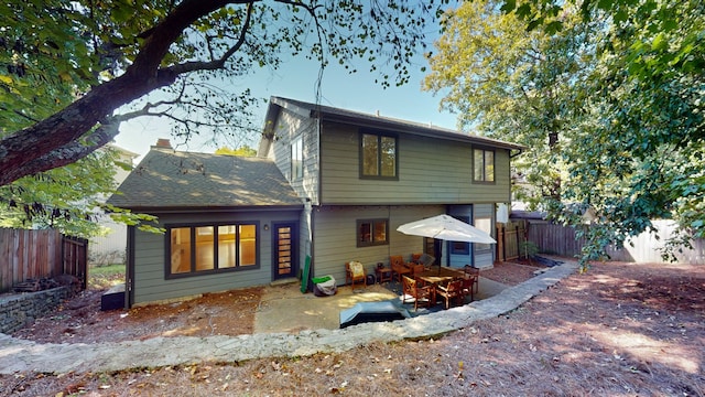 back of property with a patio area