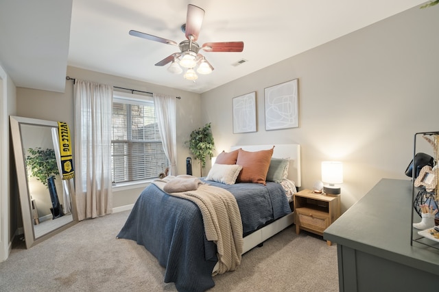 carpeted bedroom featuring ceiling fan