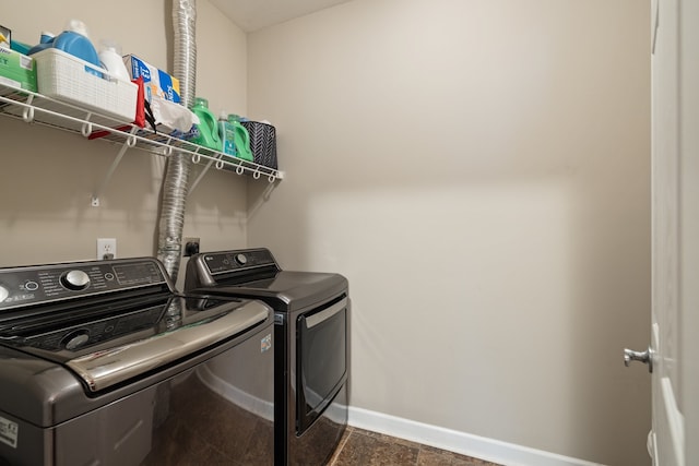 laundry room featuring washer and clothes dryer