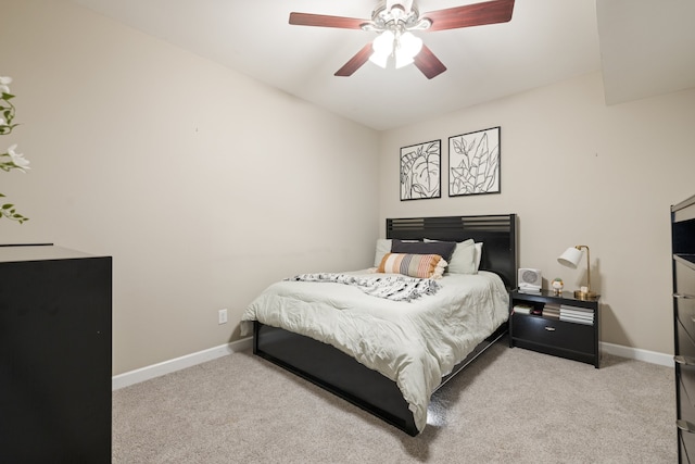 bedroom featuring light carpet and ceiling fan