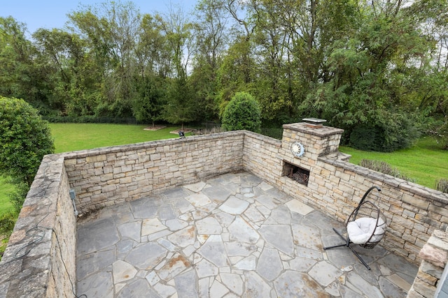 view of patio / terrace with an outdoor stone fireplace