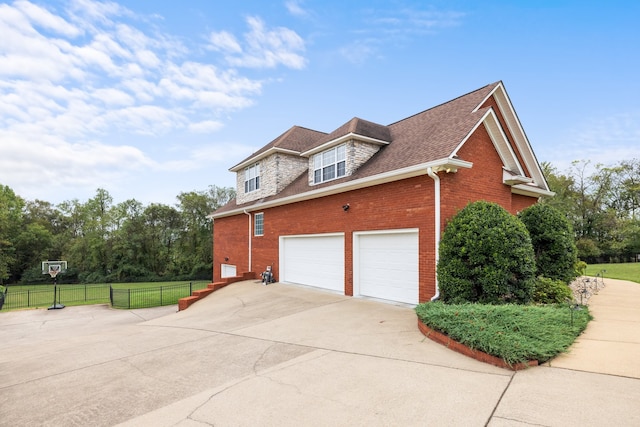 view of side of property featuring a garage