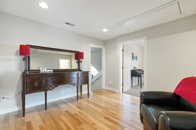 sitting room with light hardwood / wood-style floors