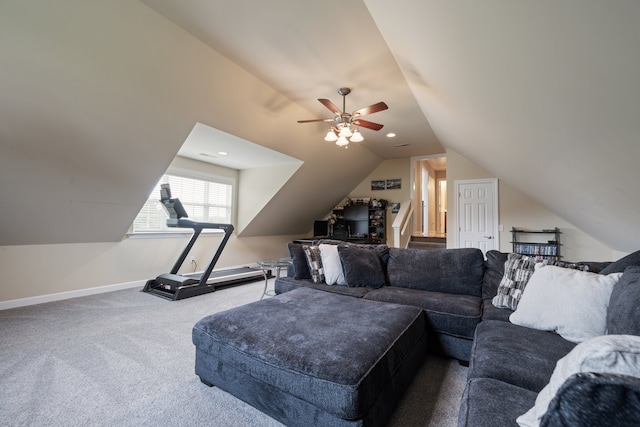 living room featuring carpet flooring, ceiling fan, and vaulted ceiling