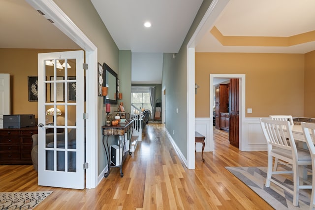 hallway with light hardwood / wood-style flooring