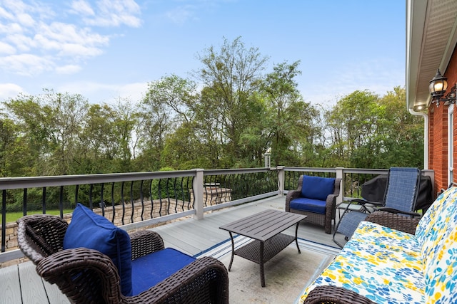 wooden terrace featuring an outdoor hangout area