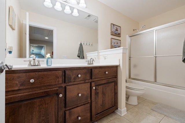 full bathroom featuring tile patterned flooring, vanity, toilet, and combined bath / shower with glass door