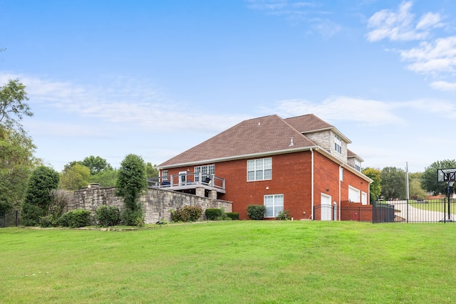 view of side of home featuring a garage and a yard