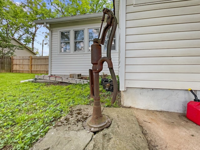 property entrance with a yard and a patio area