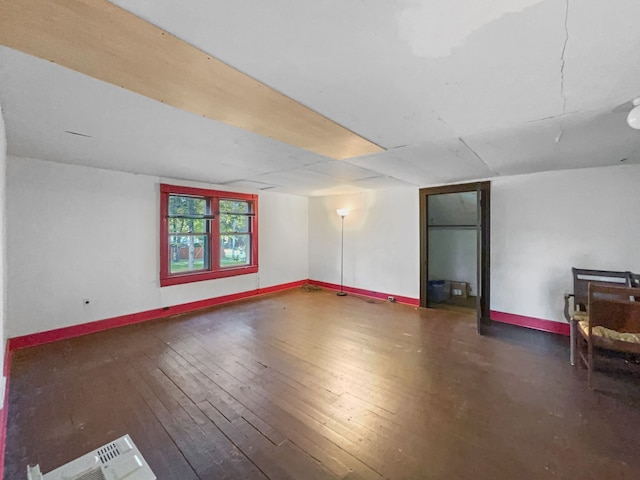 unfurnished room featuring dark hardwood / wood-style flooring