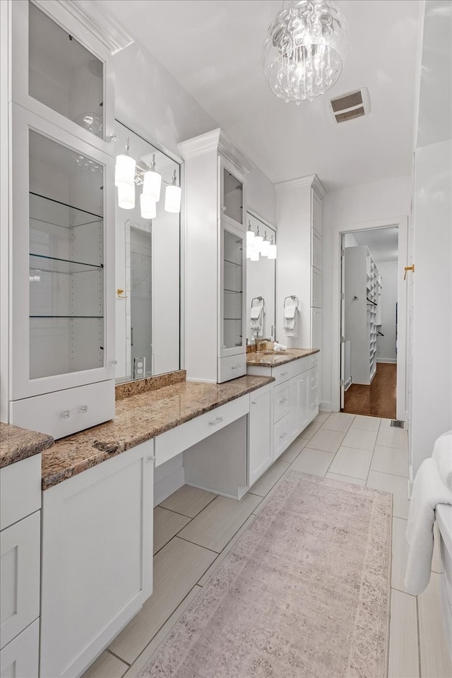 bathroom with vanity and wood-type flooring