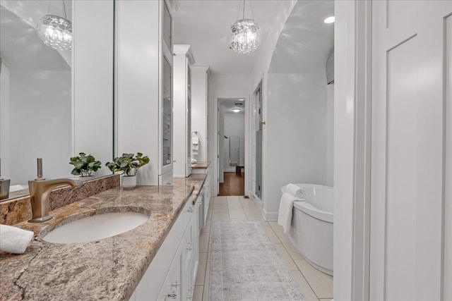 bathroom with tile patterned floors, vanity, and plus walk in shower