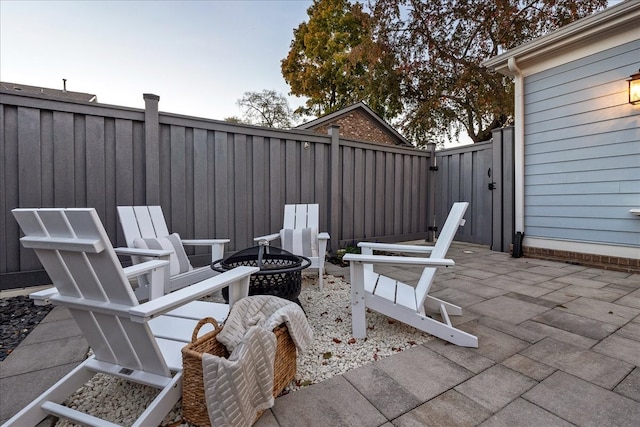 view of patio / terrace with an outdoor fire pit