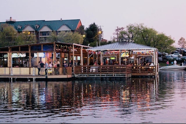 view of dock featuring a gazebo and a water view