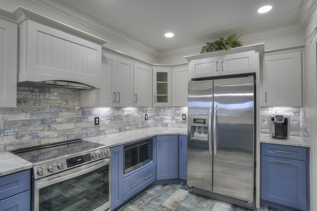 kitchen featuring ornamental molding, blue cabinetry, stainless steel appliances, and white cabinets