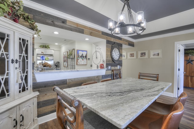 dining area with french doors, a notable chandelier, dark hardwood / wood-style floors, and ornamental molding